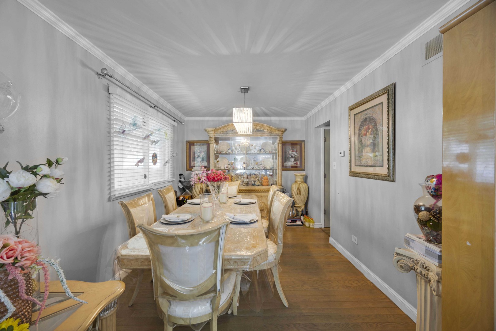 1943 182nd Street Lansing, IL 60438 - Photo 4 of 17 a view of a dining room with furniture window and wooden floor