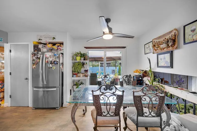a view of a dining room with furniture window and outside view