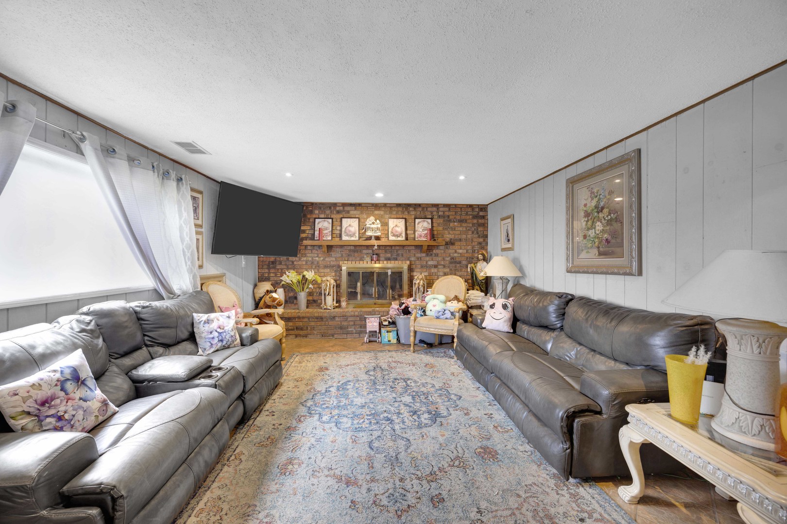 1943 182nd Street Lansing, IL 60438 - Photo 9 of 17 a living room with furniture and a large window