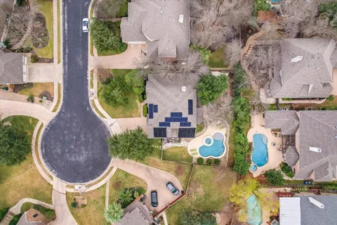 a view of a backyard with a patio and outdoor seating