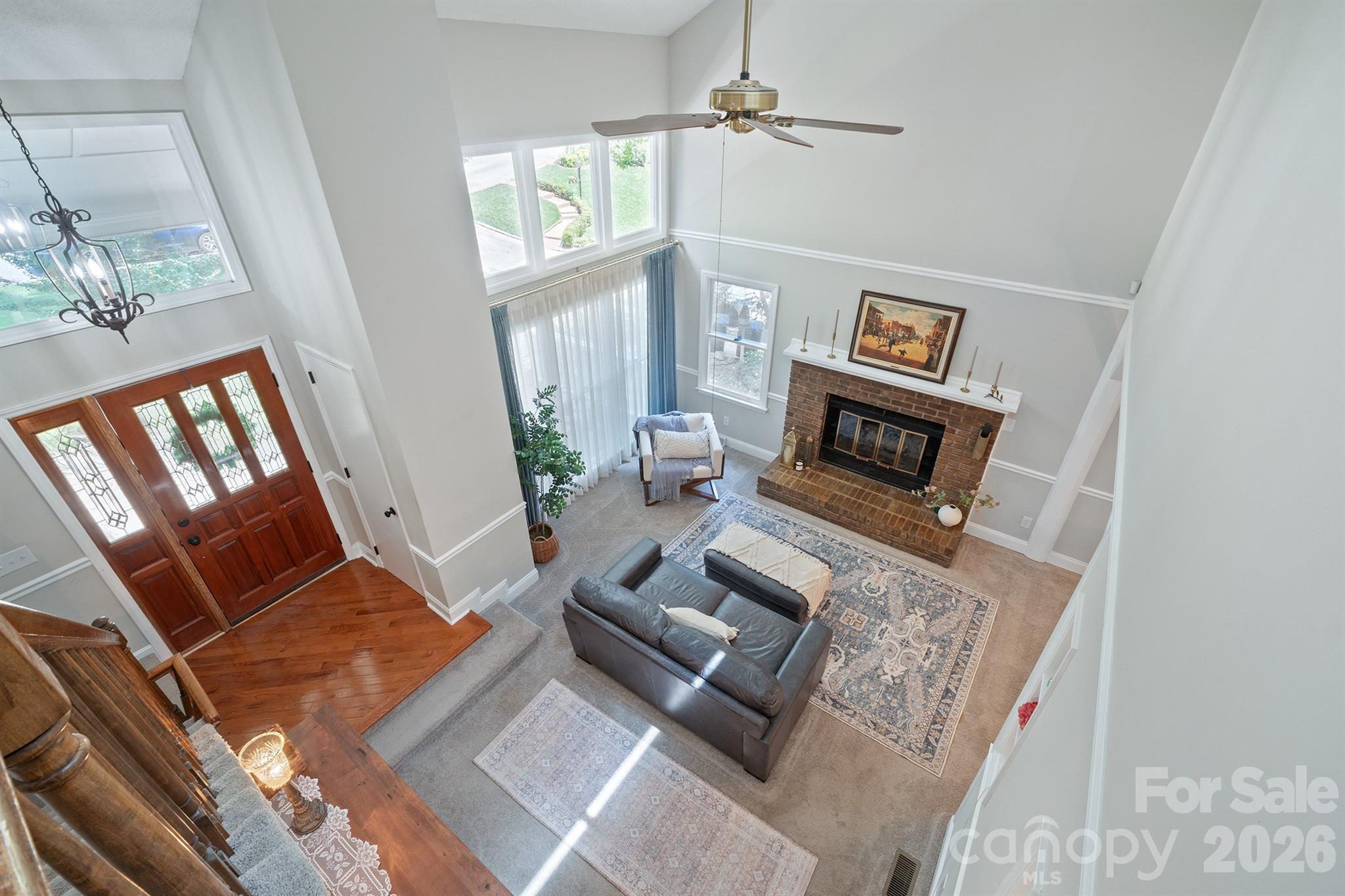 19017 Kailua Circle Tega Cay, SC 29708 - Photo 26 of 46 a living room with furniture and a fireplace