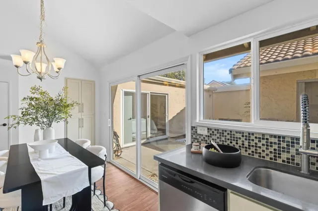 a kitchen with a table and chairs