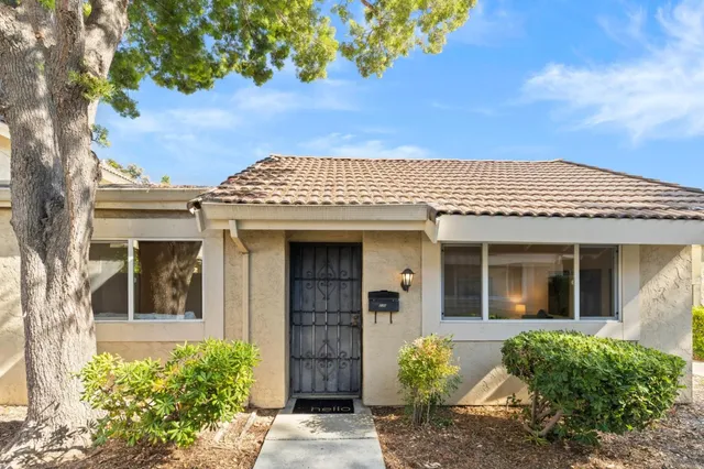 front view of a house with a garden