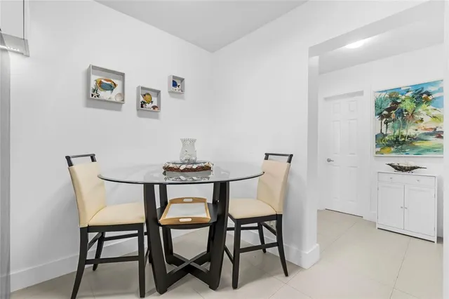 a kitchen with granite countertop a white cabinets and a stove