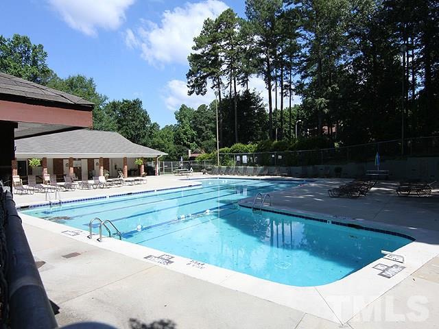 1530 Edgeside Court Raleigh, NC 27609 - Photo 20 of 20 a view of swimming pool with lawn chairs and plants