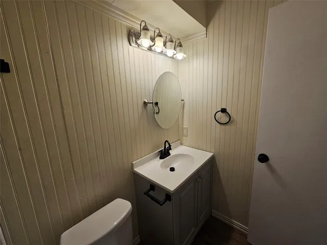 a bathroom with a sink and mirror