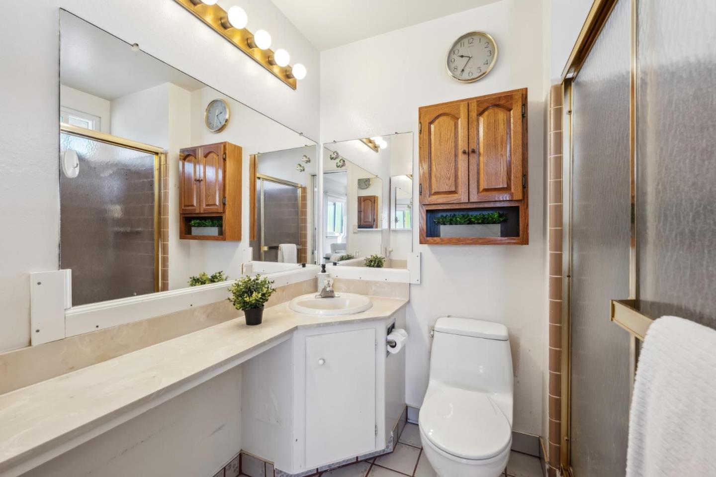 206 Lassen Drive San Bruno, CA 94066 - Photo 17 of 34 a bathroom with a granite countertop sink mirror vanity and toilet