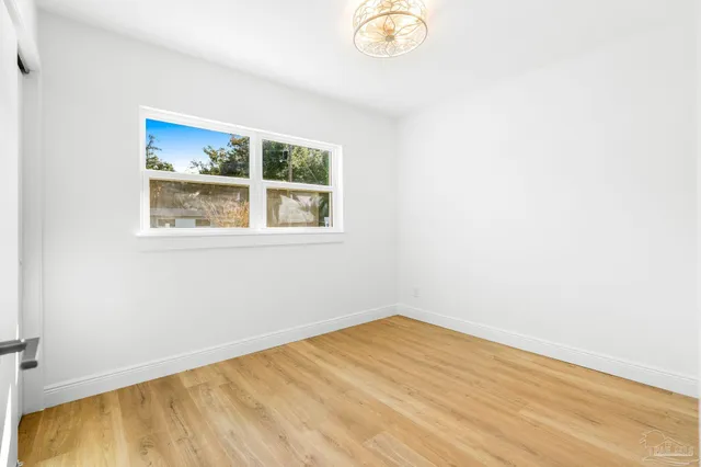 a swimming pool with wooden fence