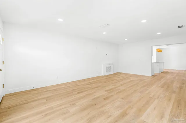 a kitchen with stainless steel appliances a stove a sink and a microwave