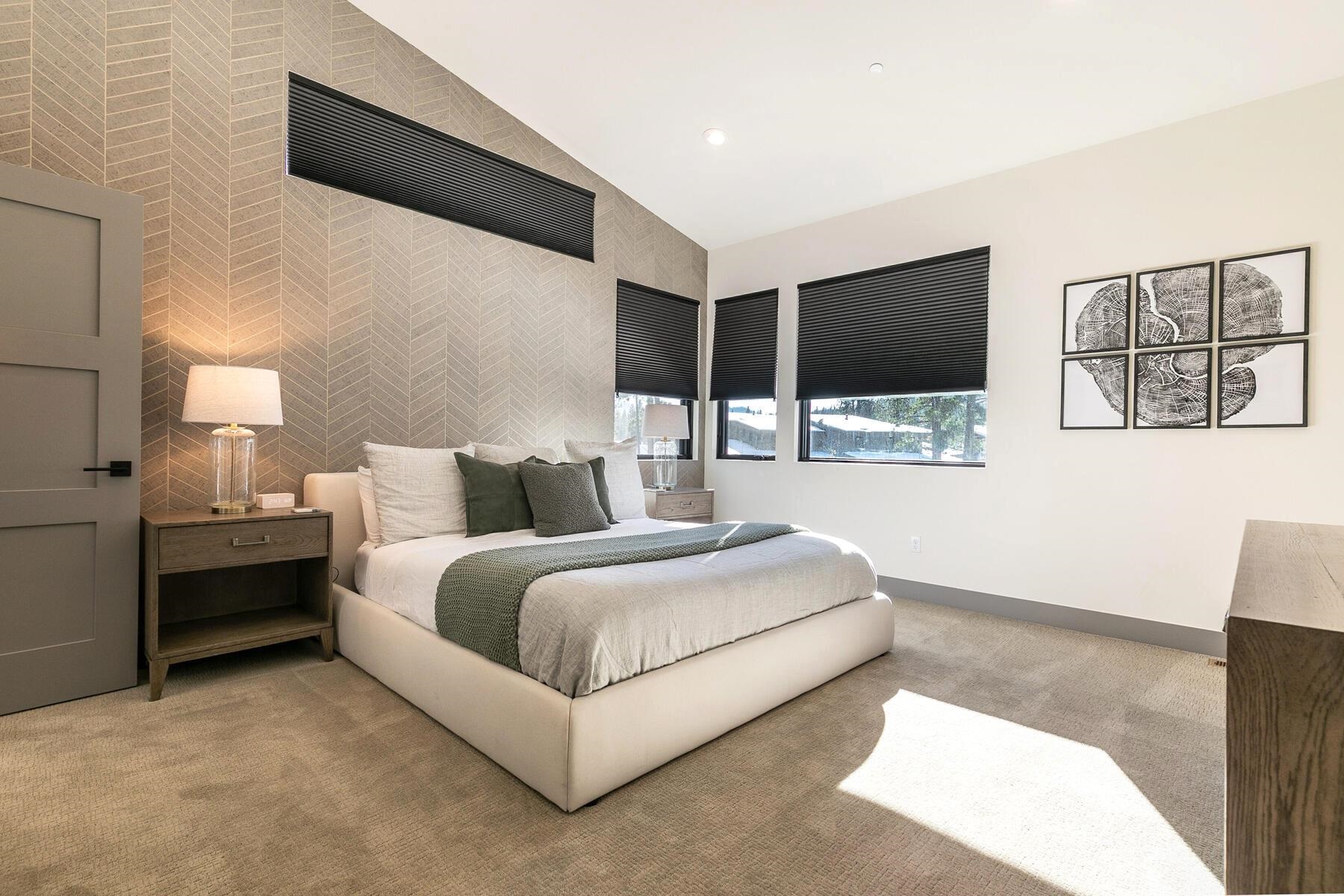 10316 Shady Lane Truckee, CA 96161 - Photo 12 of 21 a spacious bedroom with a bed and a flat screen tv