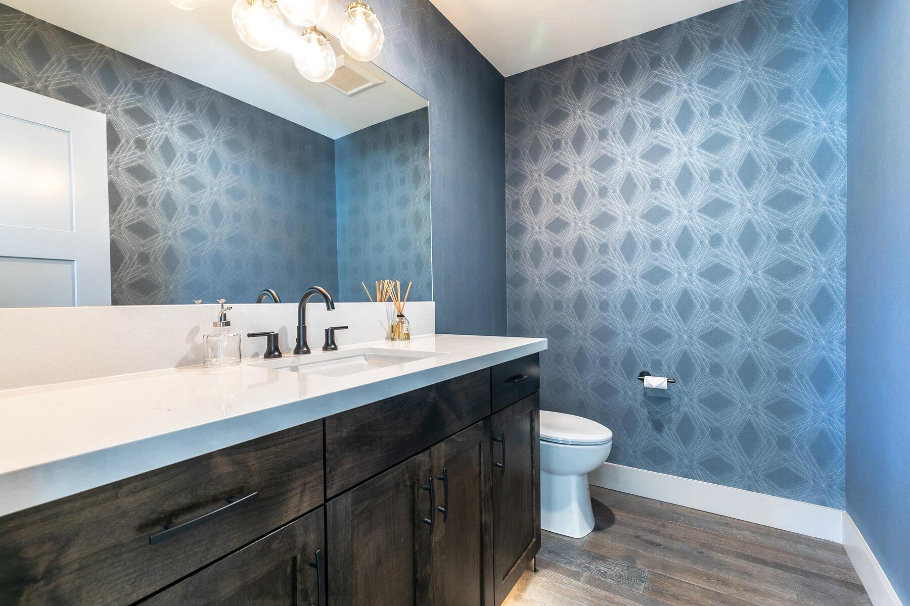 10316 Shady Lane Truckee, CA 96161 - Photo 13 of 21 a bathroom with a sink a toilet a mirror and shower
