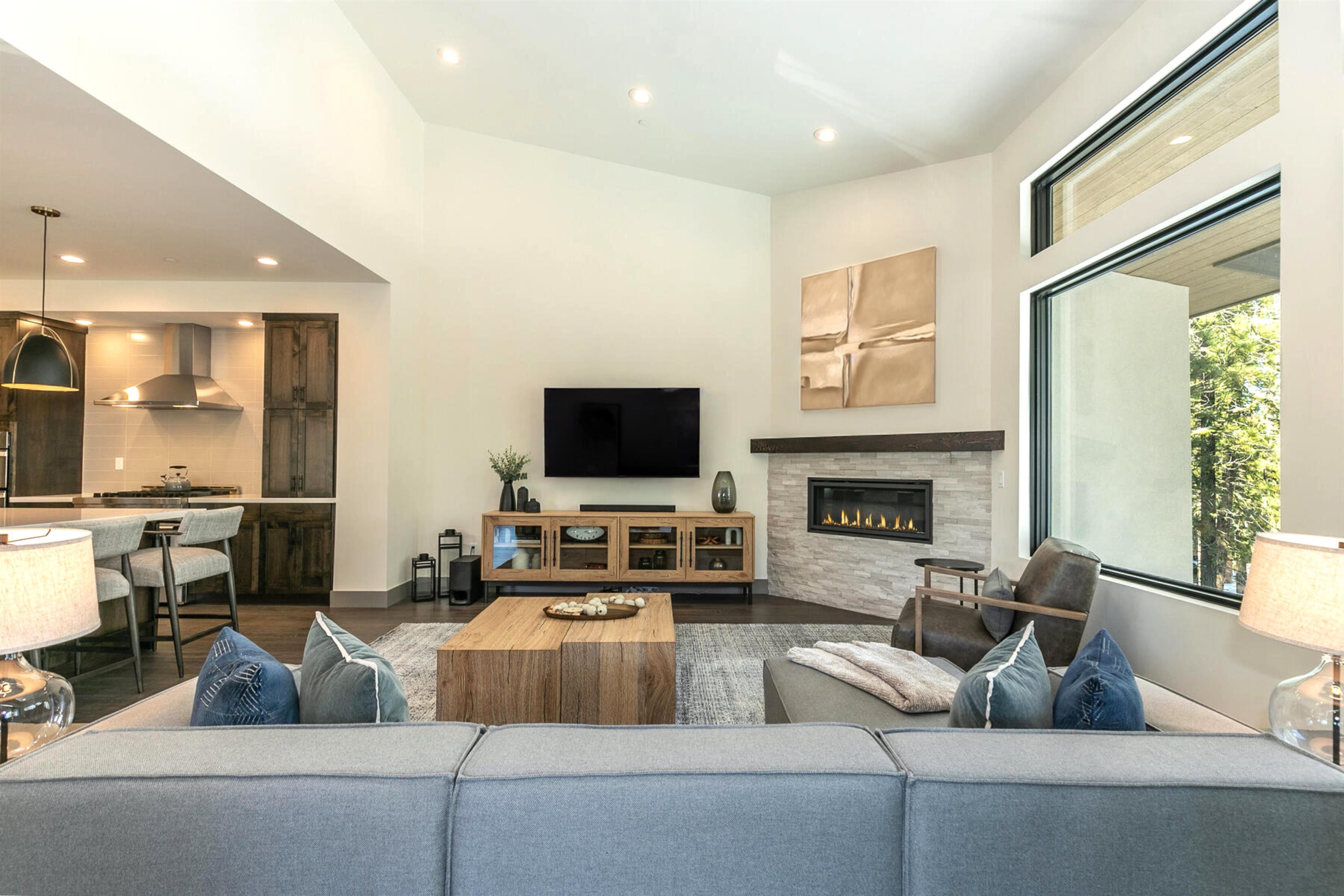 10316 Shady Lane Truckee, CA 96161 - Photo 6 of 21 a living room with furniture a flat screen tv and a fireplace