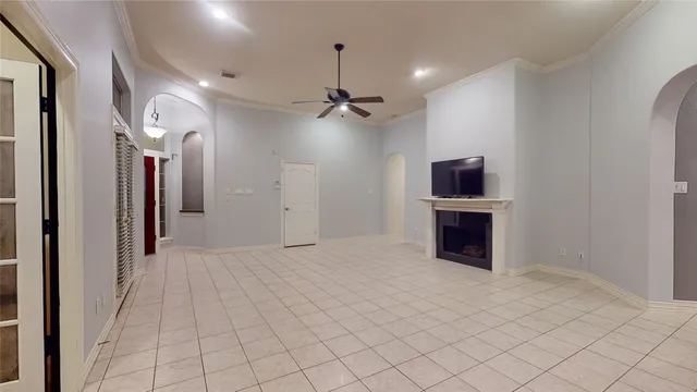 a view of a kitchen with furniture and a ceiling fan