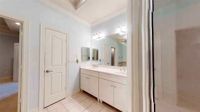 a en suite bathroom with a sink a mirror and a shower