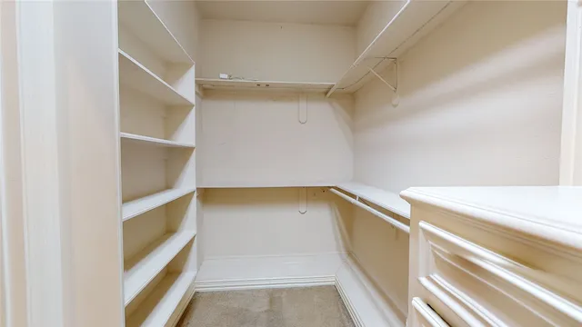 a view of an empty walk in closet