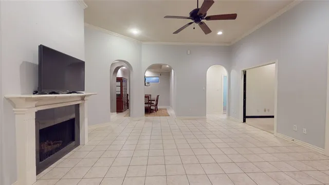 a view of living room with furniture and a fireplace