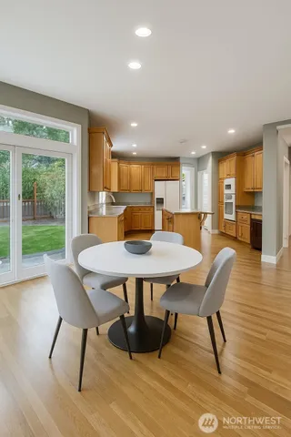 a view of a dining room with furniture window and wooden floor
