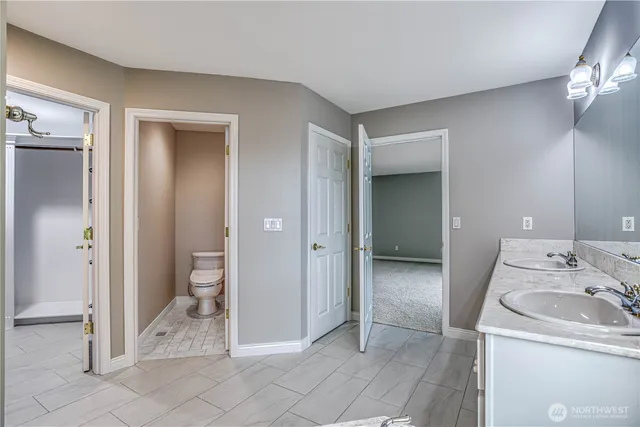 a bathroom with a sink and mirror