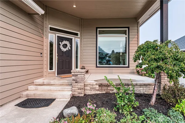 a front view of a house with garden