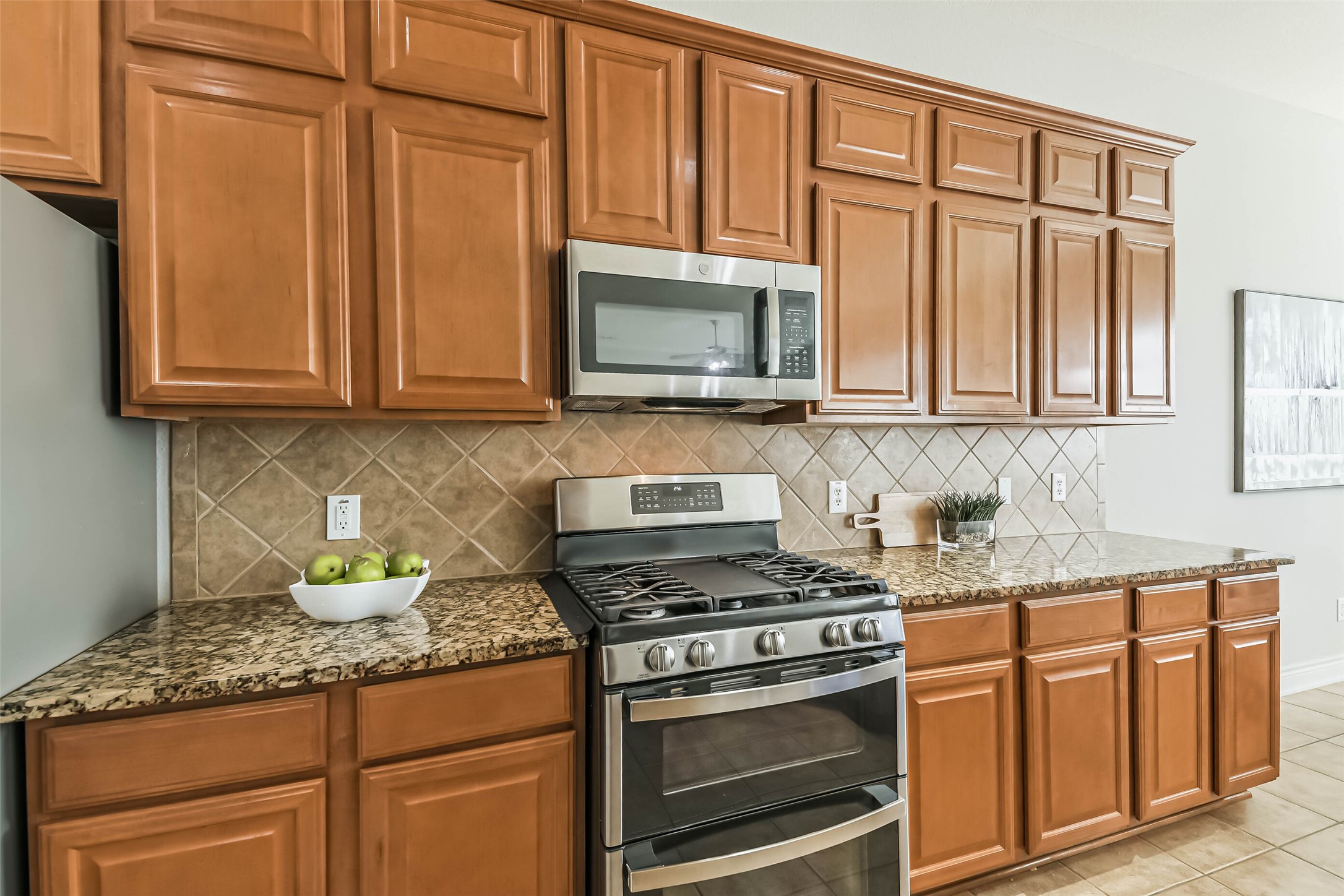 19022 Greenleaf Ridge Court Cypress, TX 77429 - Photo 19 of 47 a kitchen with granite countertop cabinets stainless steel appliances and a sink