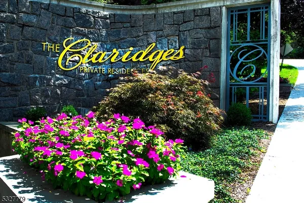 a sign that is in front of flowers