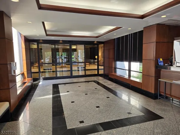 a view of a living room with a large window