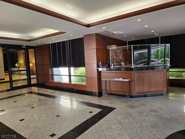 a kitchen with stainless steel appliances granite countertop a sink and a stove