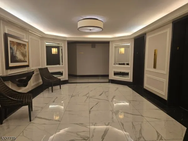 a living room with furniture a window and glass door