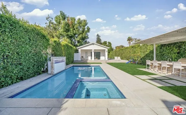 a view of house with yard entertaining space and seating area