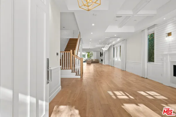 a view of a hallway view with staircase