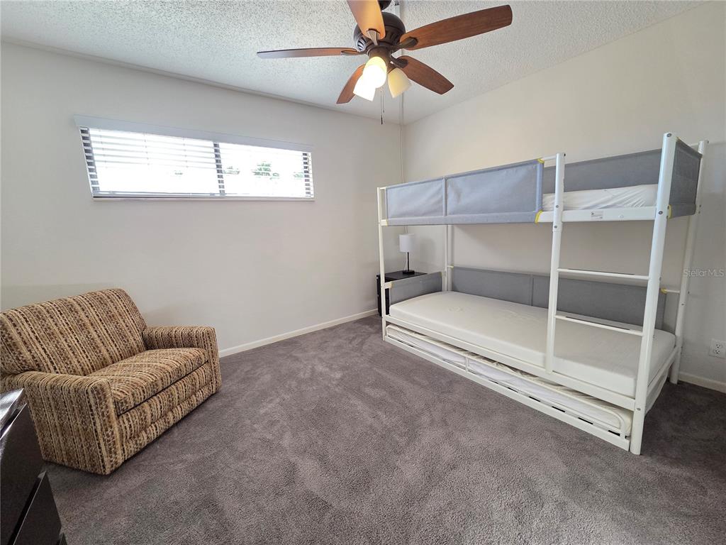 401 150th Avenue, Unit 223 Madeira Beach, FL 33708 - Photo 16 of 50 a living room with furniture