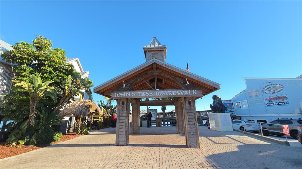 401 150th Avenue, Unit 223 Madeira Beach, FL 33708 - Photo 37 of 50 a view of a chairs and table in the patio