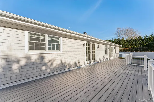 a view of a house with wooden deck