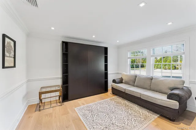 a living room with furniture and a rug