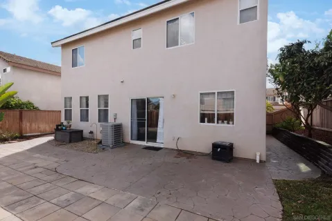 a view of swimming pool with a yard and large trees