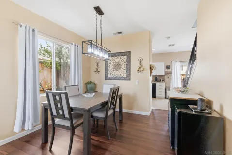 a view of a dining room with furniture window and wooden floor