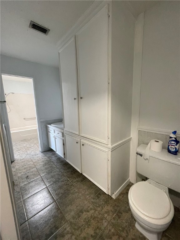 4201 Walnut Hills Drive Corpus Christi, TX 78413 - Photo 13 of 19 a white toilet sitting next to a bathroom sink