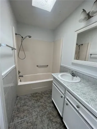 an empty room with a empty space and windows
