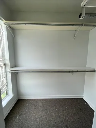 a view of a room with a wooden floor
