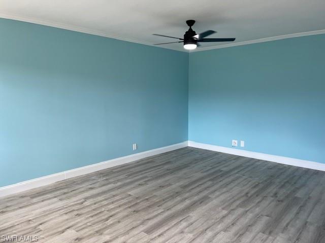 473 12th Avenue South, Unit B2 Naples, FL 34102 - Photo 11 of 23 a view of an empty room with wooden floor