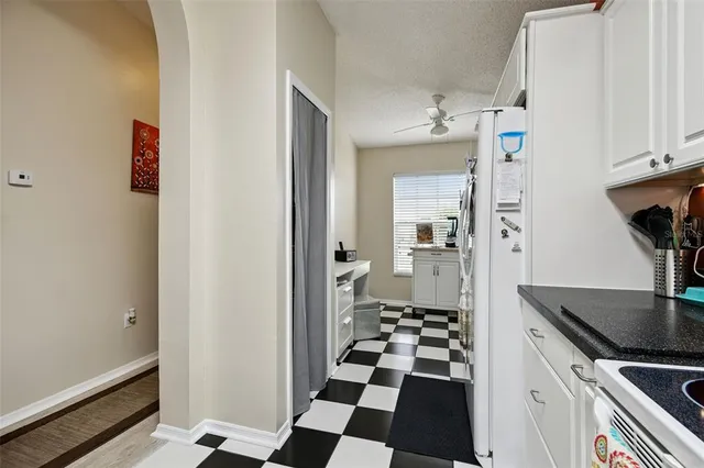 a bedroom with bed couch and window