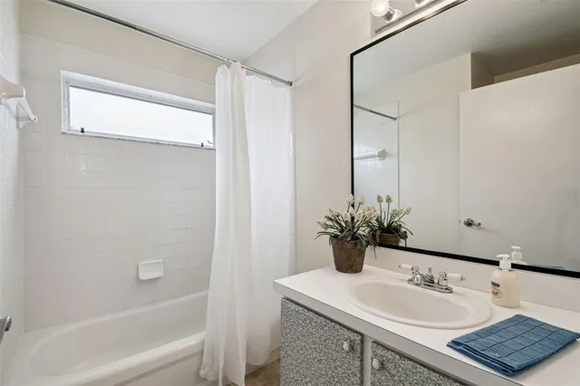 an aerial view of a houses with a swimming pool