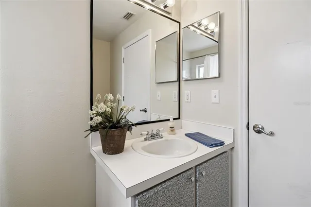 an aerial view of a city with lots of residential buildings and ocean view