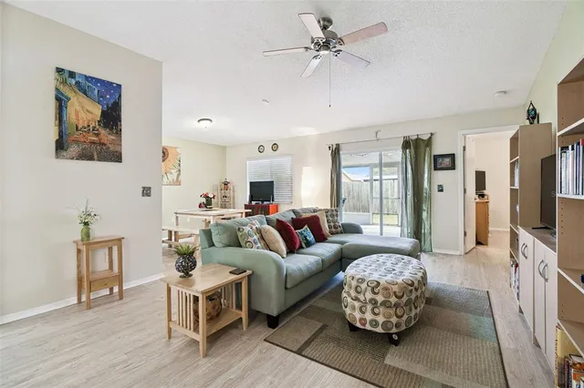 a kitchen with granite countertop a sink a stove and cabinets