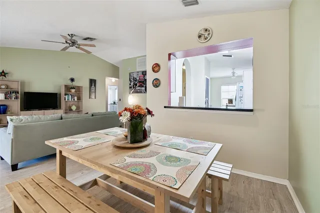 a kitchen with a refrigerator a sink and cabinets