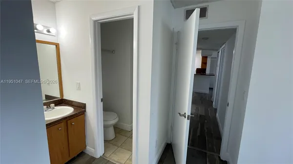a bathroom with a toilet and a sink
