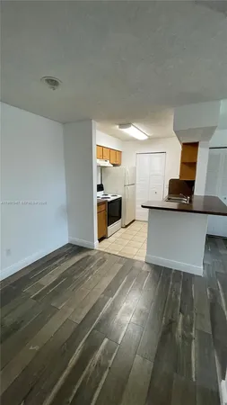 a view of a kitchen with a sink
