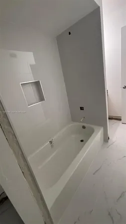 a bathroom with a bathtub