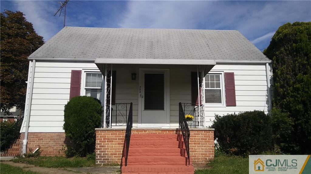 522 Crows Mill Road Fords, NJ 08863 - Photo 1 of 14 a front view of a house with garden