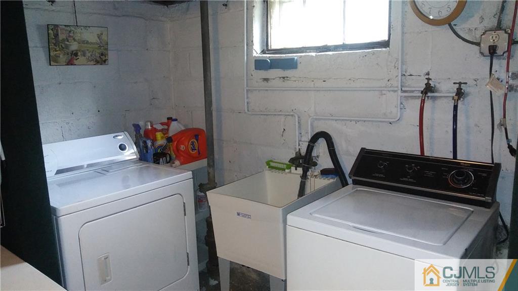 522 Crows Mill Road Fords, NJ 08863 - Photo 13 of 14 a utility room with dryer and washer